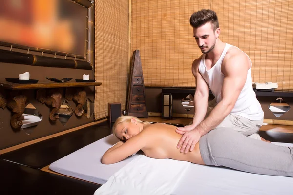 Young adult woman receiving a massage — Stock Photo, Image