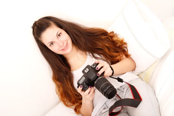 Playing with camera in the bed — Stock Photo, Image