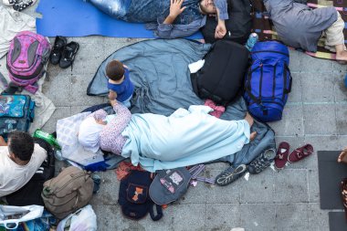 Refugees and Migrants stranded at the Keleti Trainstation in Bud clipart