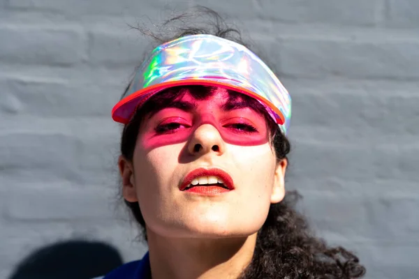 Portrait of a young woman wearing a retro visor — Stock Photo, Image