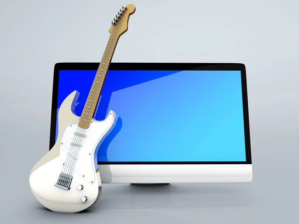 Ein All-in-One-Computer mit einer Gitarre — Stockfoto