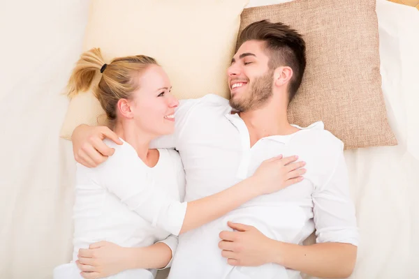 Happy young couple in Bed — Stock Photo, Image