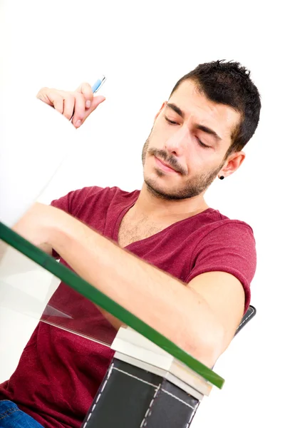 Young male thinking in the office — Stock Photo, Image