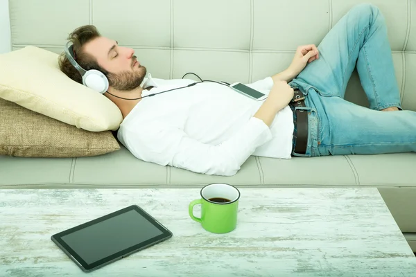 Listening music on the Sofa — Stock Photo, Image