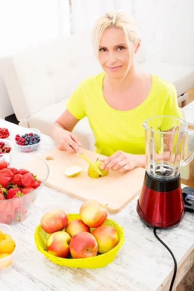 Woman with headphones and tablet in bed — Stock Photo, Image