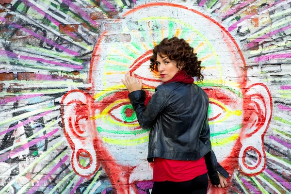 Beautiful woman posing with graffiti head — Stok Foto