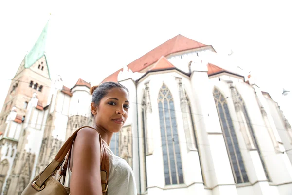 Young woman at the cathedral — 스톡 사진