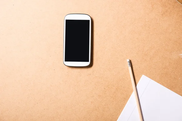 Smartphone and a exercise book — Stock Photo, Image