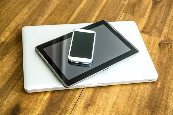 Digital devices on a wooden Desktop — Stock Photo, Image