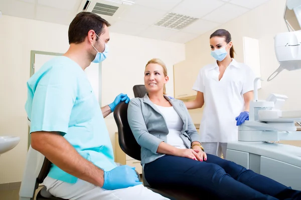 Adult woman getting her checkup at the Dentist Stock Picture