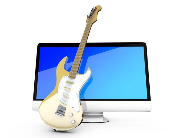 Een alles in een computer met een gitaar — Stockfoto