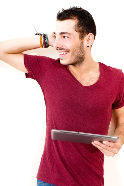 Mladý muž pomocí tabletu — Stock fotografie