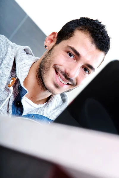 Close-up of young man with laptop — Stock Photo, Image