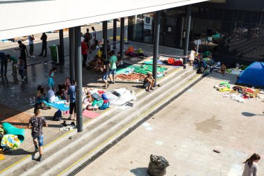 Illegal Immigrants camping at the Keleti Trainstation in Budapes clipart