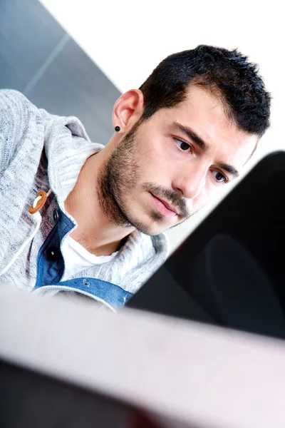 Close-up of young man with laptop — Stock Photo, Image