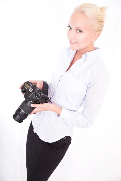 Blond girl with camera — Stock Photo, Image