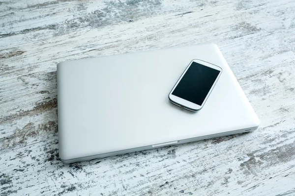 Smartphone and a laptop computer — Stock Photo, Image