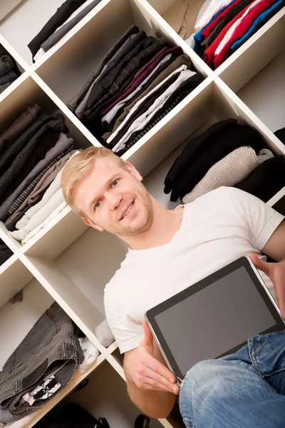 Young man with his wardrobe — Stock Photo, Image