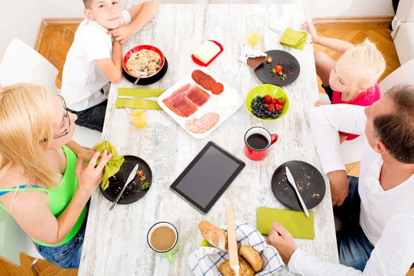 Modern family having breakfast — Stock Photo, Image