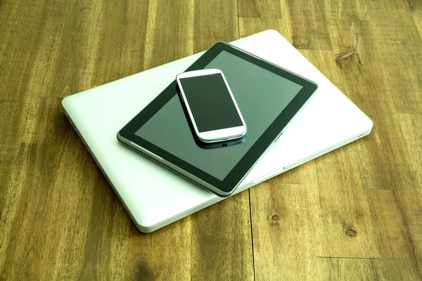 Digital devices on a wooden Desktop — Stock Photo, Image