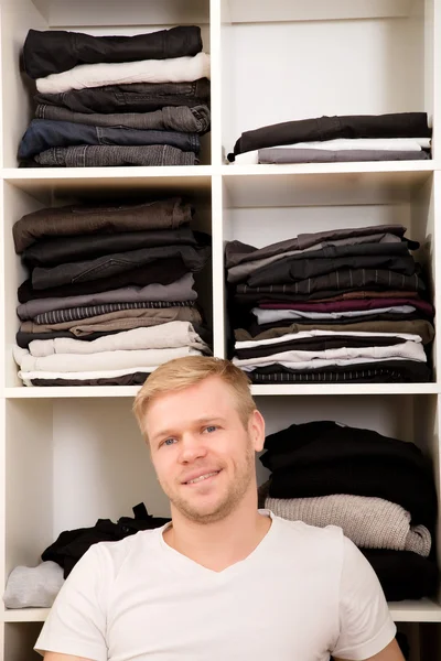 Young man with his wardrobe — Stock Photo, Image