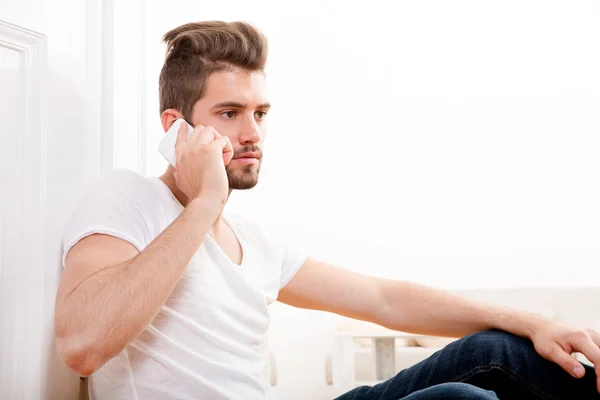 Portrait of young adult using phone — Stock Photo, Image