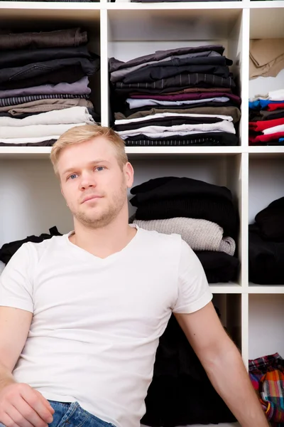 Young man with his wardrobe — Stock Photo, Image