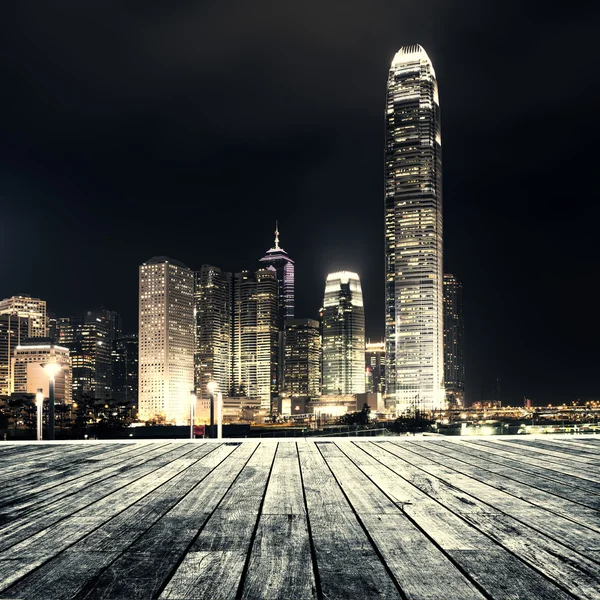 Wooden platform and city — Stock Photo, Image