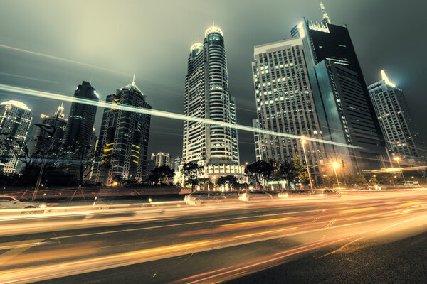 The light trails on the modern building background in shanghai china