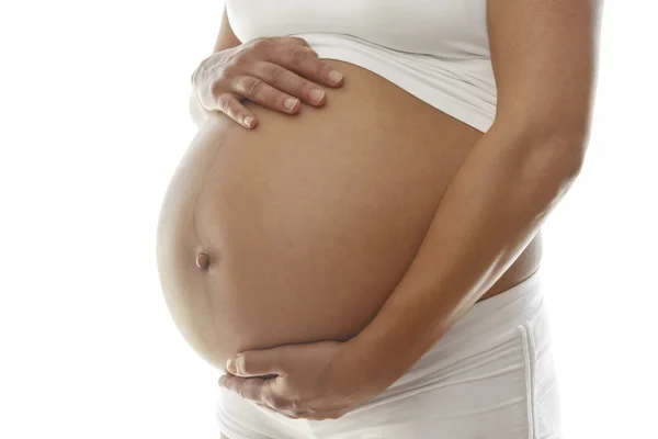 Mulher grávida segurando sua barriga — Fotografia de Stock