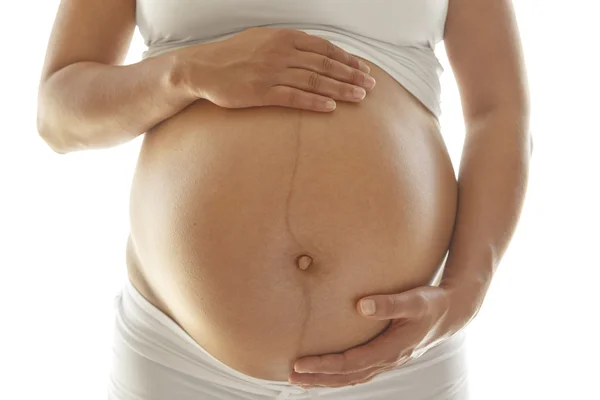 Mulher grávida segurando sua barriga — Fotografia de Stock