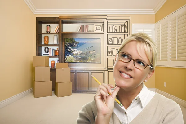 Female Holding Pencil In Room With Drawing of Entertainment Unit — Stock Photo, Image