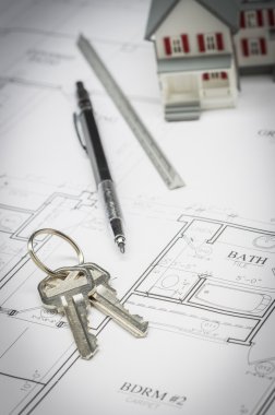 Ev, kalem, cetvel ve ev planları üzerinde dinlenme tuşları