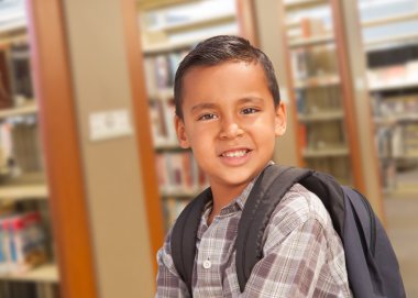 Hispanic Student Boy with Backpack in the Library clipart