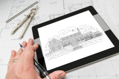 El bilgisayar Tablet gösteren ev illüstrasyon planları üzerinde üzerinde mimar