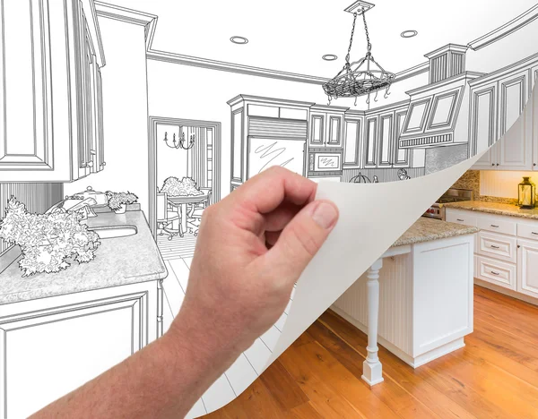 Mão virando página de desenho de cozinha personalizada para fotografia . — Fotografia de Stock