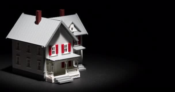 Spot Lit Model House Slowly Rotating Dark Background — Stock Video