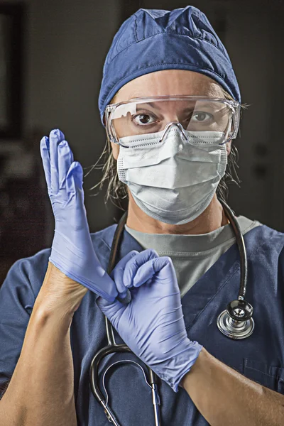 Concerned Female Doctor or Nurse Putting on Protective Facial We — Stock Photo, Image