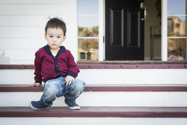 Melancholy Mixed Race Boy Sitting on Front Porch Steps — Stock Photo, Image