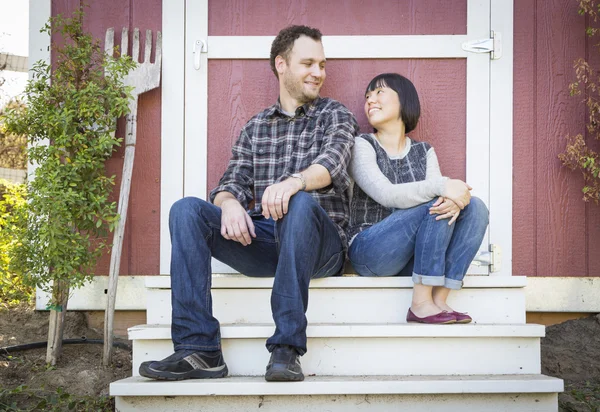 Mixed Race Couple Relaxing on the Steps — Stock Photo, Image