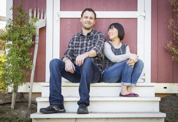 Mixed Race Couple Relaxing on the Steps — Stock Photo, Image