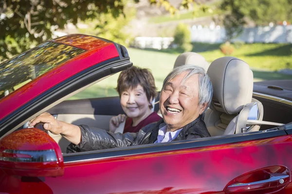 Happy Chinese Couple Enjoying An Afternoon Drive in Their Conver — Stock Photo, Image