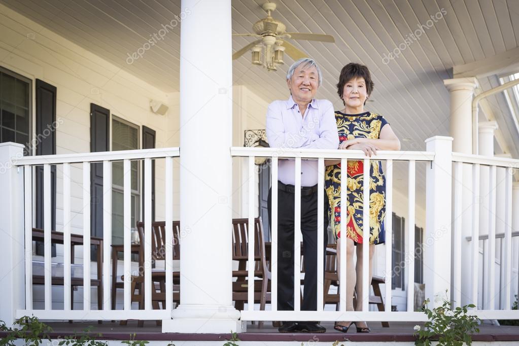 Attractive Chinese Couple Enjoying Their House