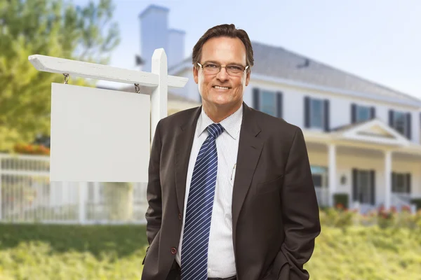 Male Real Estate Agent in Front of Blank Sign and House — Stock Photo, Image