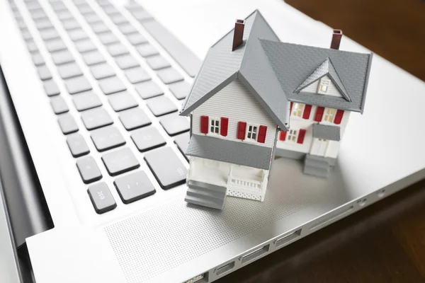 Miniature House on Laptop Computer — Stock Photo, Image