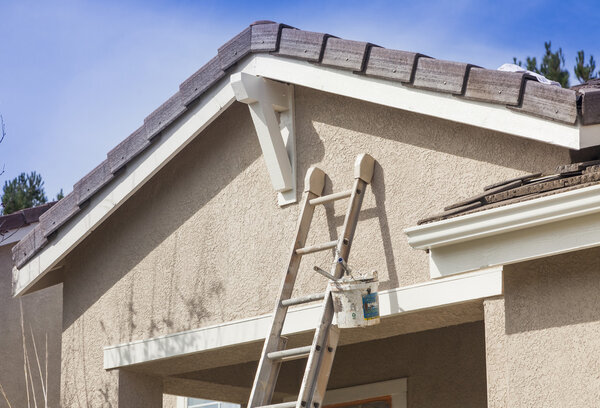 Ladder Leaning Up Against A House Ready For New Paint