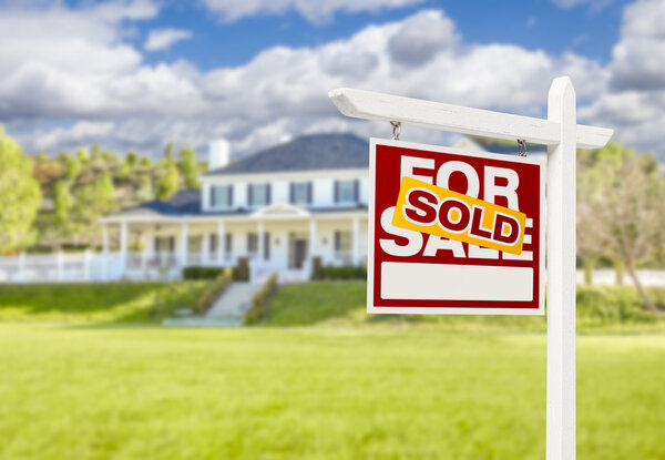 Sold Home For Sale Sign in Front of New House