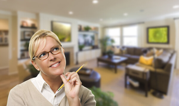 Daydreaming Woman with Pencil Inside Beautiful Living Room