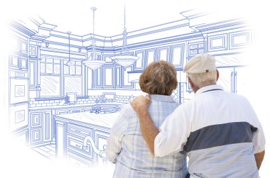 Senior Couple Looking Over Blue Custom Kitchen Design Drawing clipart