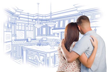 Young Military Couple Looking Over Custom Kitchen Design Drawing clipart